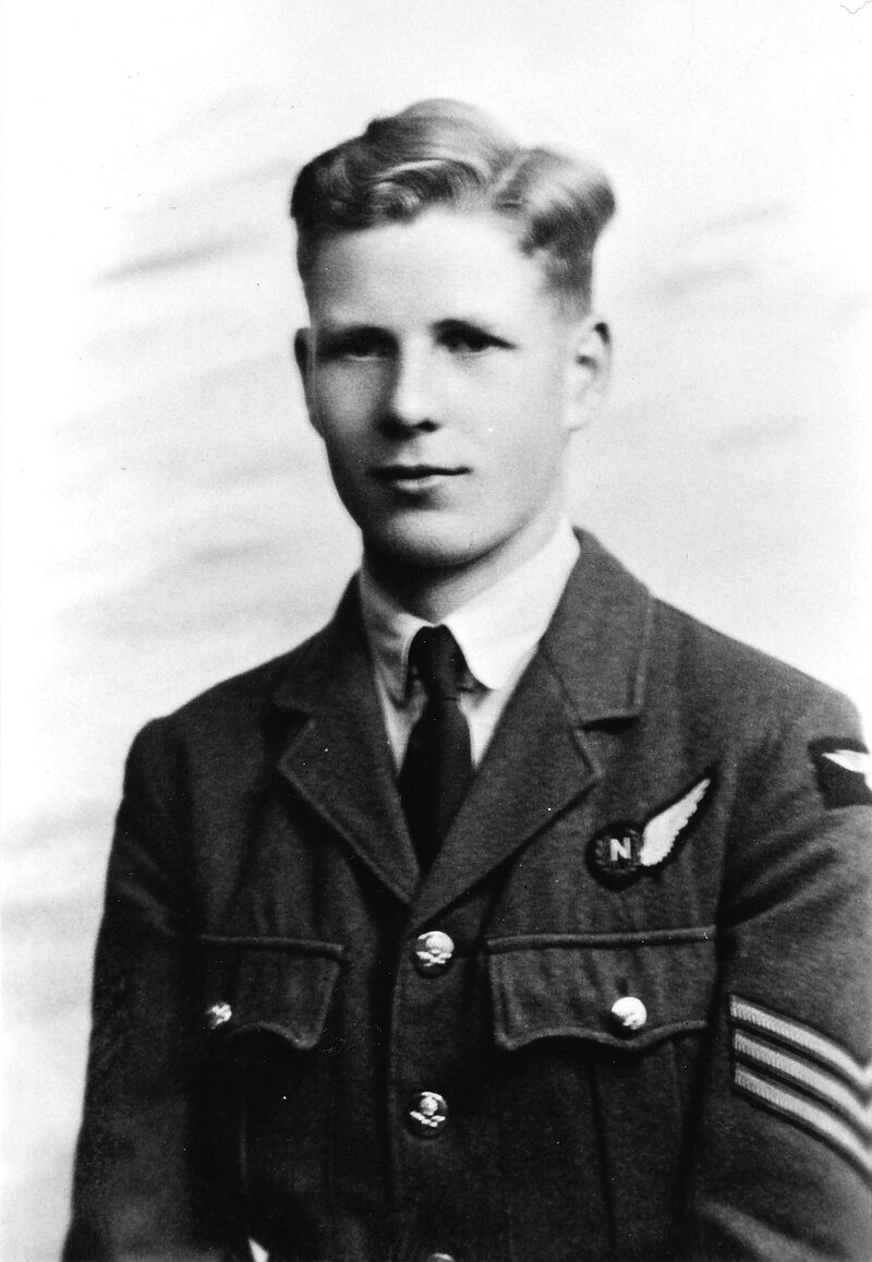 Studio portrait of Sergeant E G White in RAF uniform wearing the navigator’s ‘N’ brevet, Torquay, 1942.